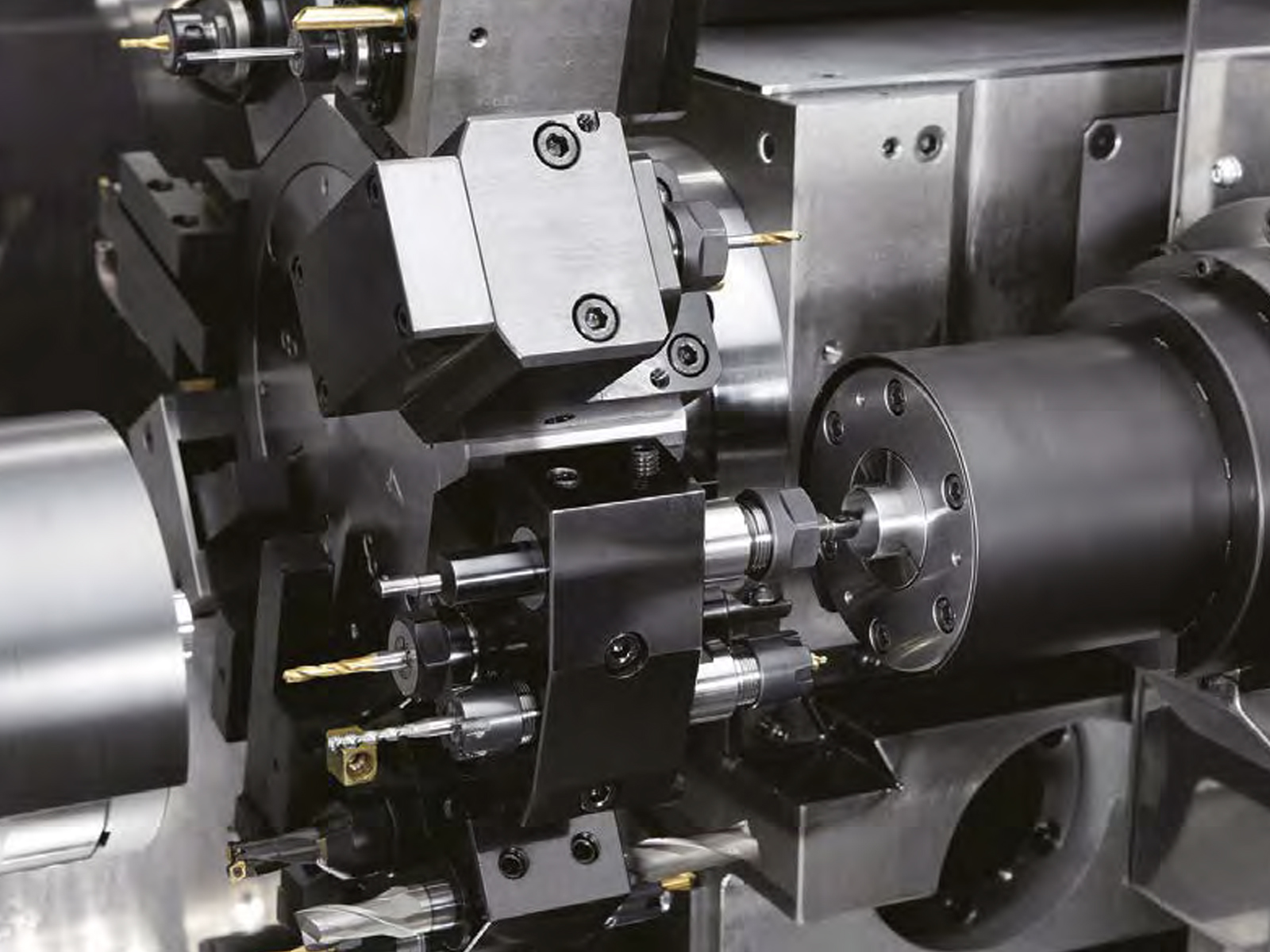 Back machining using tools installed in a triple sleeve holder