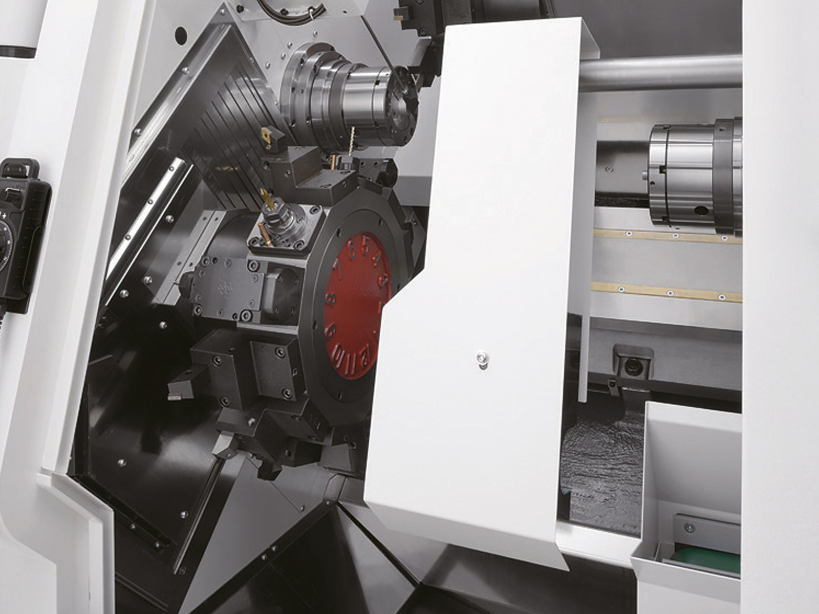 Discharges workpiece on to conveyor.